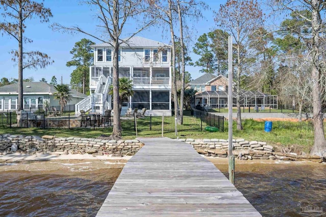 35868 Boykin Blvd, Lillian, AL 36549 - view of dock featuring a balcony, a water view, a fenced backyard, and stairway