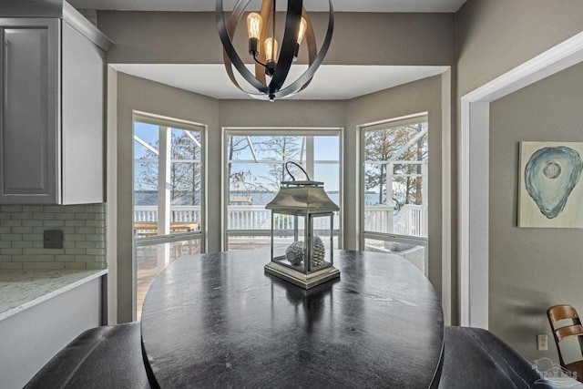 35868 Boykin Blvd, Lillian, AL 36549 - dining area with a chandelier and a wealth of natural light