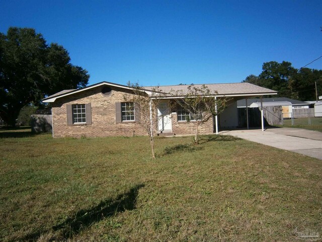 single story home with a front yard and a carport