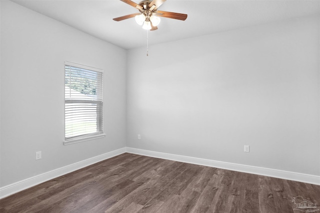 unfurnished room featuring ceiling fan and dark hardwood / wood-style flooring