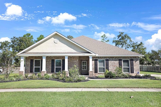 craftsman-style house with a front lawn