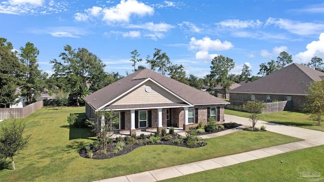 craftsman-style home featuring a front lawn