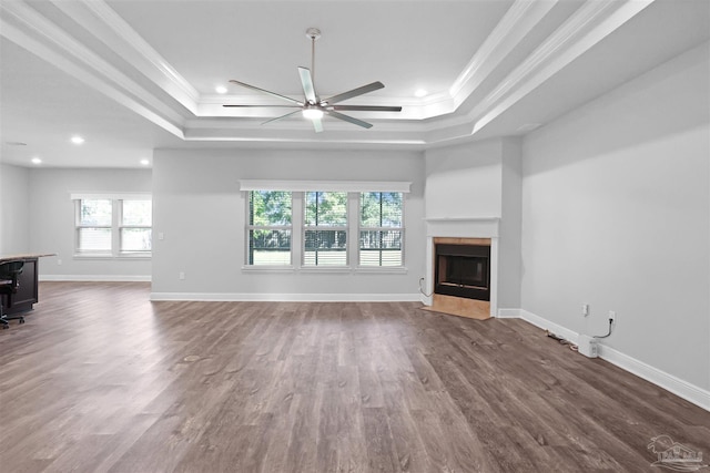 unfurnished living room featuring ceiling fan, crown molding, and hardwood / wood-style floors