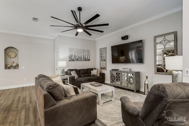 living room with ceiling fan, hardwood / wood-style flooring, and ornamental molding