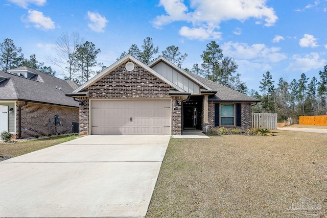 view of front facade with central AC, a garage, and a front lawn