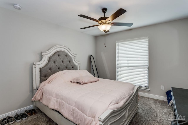 bedroom featuring dark carpet and ceiling fan