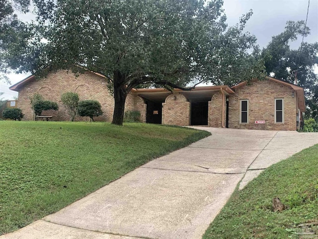 single story home featuring a carport and a front yard