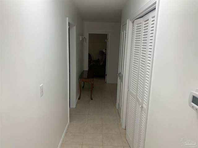 hallway featuring light tile patterned flooring