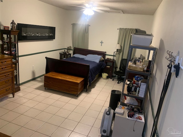 bedroom featuring light tile patterned flooring and ceiling fan