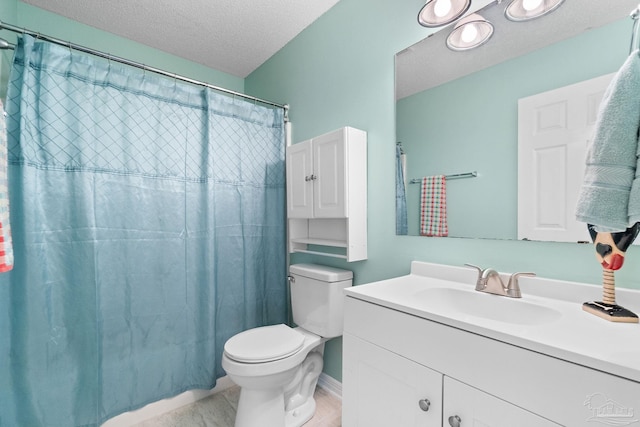 bathroom featuring toilet, a shower with curtain, a textured ceiling, and vanity