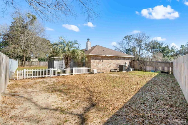 view of yard featuring cooling unit and a fenced backyard