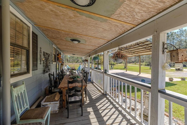 wooden terrace with a porch