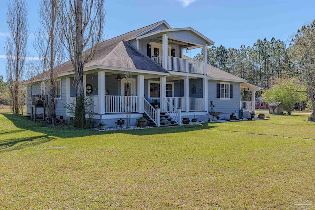 view of front facade with a balcony, a porch, a shingled roof, and a front lawn