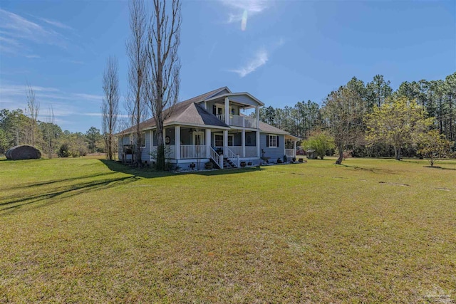farmhouse inspired home with a balcony, a porch, and a front lawn