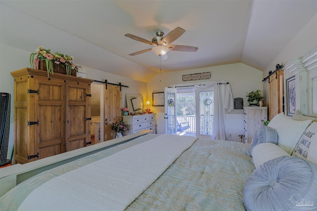 bedroom with lofted ceiling, a barn door, ceiling fan, and access to outside