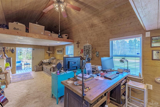office space with lofted ceiling, carpet flooring, wooden ceiling, wooden walls, and a ceiling fan