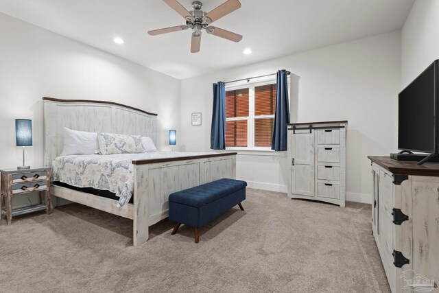 carpeted bedroom with ceiling fan