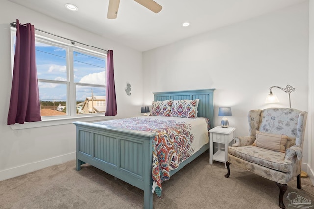 carpeted bedroom with ceiling fan