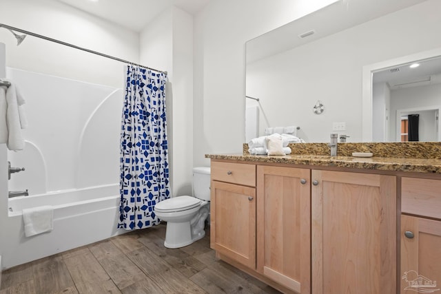 full bathroom featuring toilet, vanity, shower / bath combo, and hardwood / wood-style flooring