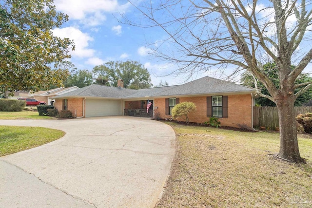 single story home featuring a garage, brick siding, a chimney, fence, and a front yard