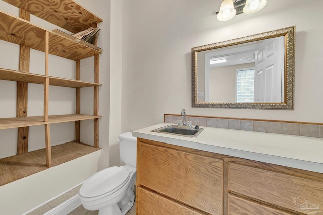 bathroom with vanity and toilet