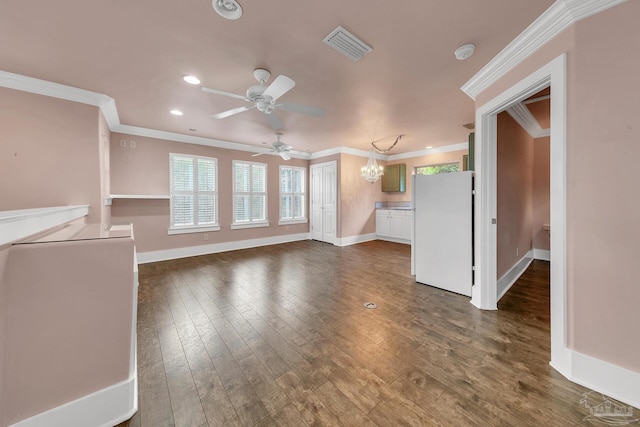 unfurnished living room featuring dark wood-style floors, ornamental molding, visible vents, and baseboards