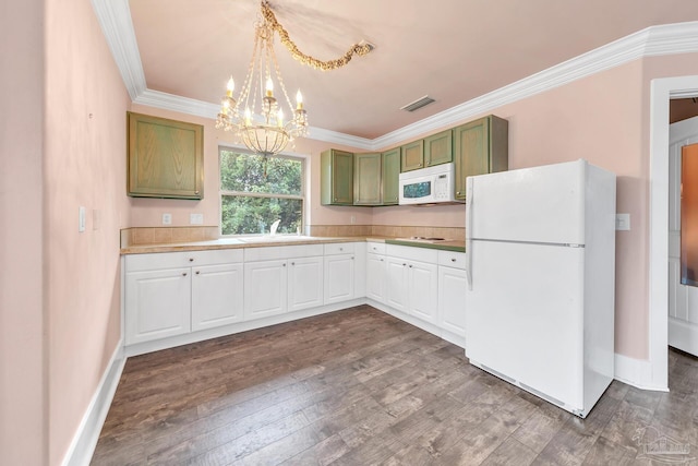 kitchen with white appliances, wood finished floors, visible vents, light countertops, and ornamental molding