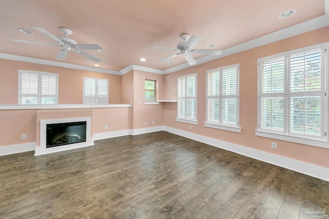 unfurnished living room featuring dark wood-type flooring, recessed lighting, crown molding, and baseboards