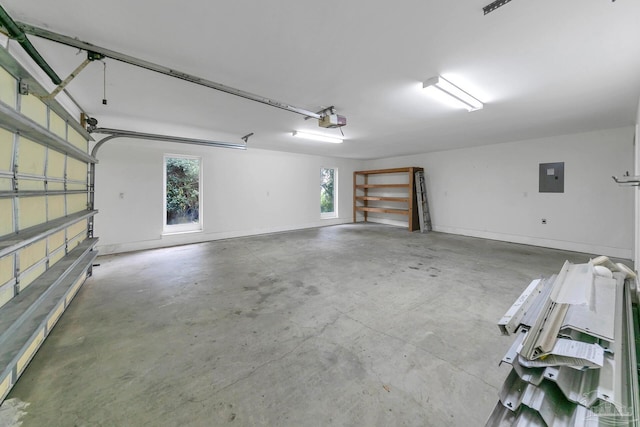 garage with electric panel, baseboards, and a garage door opener