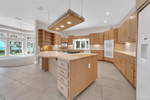 kitchen featuring open shelves, white appliances, visible vents, light countertops, and light brown cabinetry