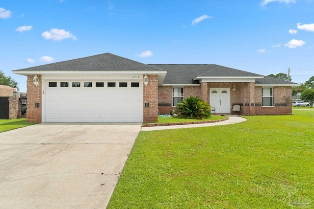 view of front facade with a garage and a front yard