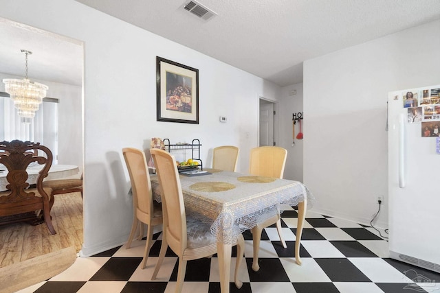 dining room featuring a chandelier