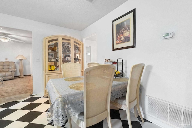 dining area with ceiling fan