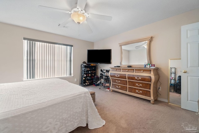 bedroom with ceiling fan and carpet