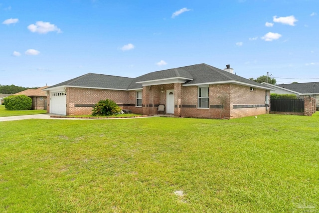 ranch-style home featuring a garage and a front lawn