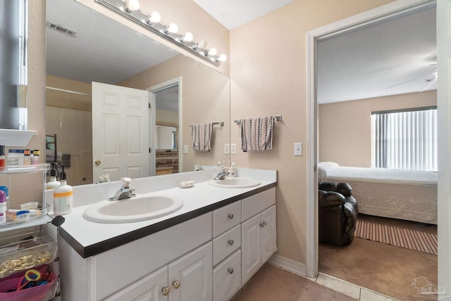 bathroom with vanity and tile patterned flooring