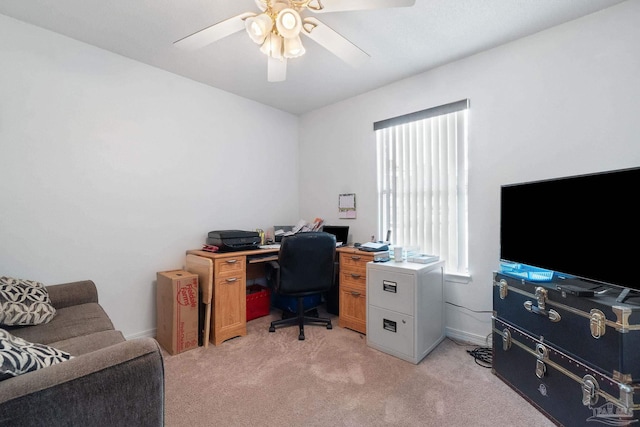 home office with ceiling fan and light carpet