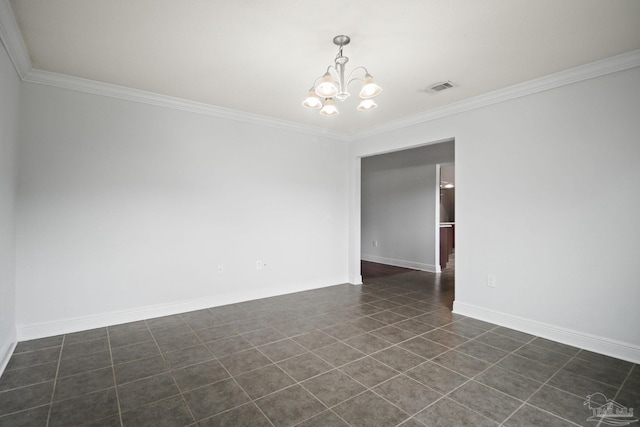 empty room with crown molding, a chandelier, and dark tile patterned flooring