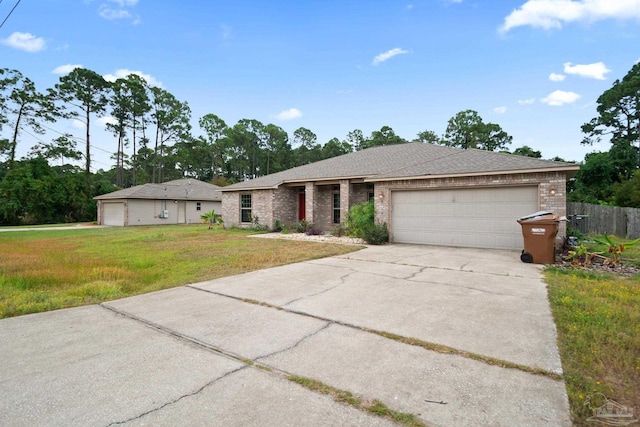 view of front of property featuring a front lawn and a garage