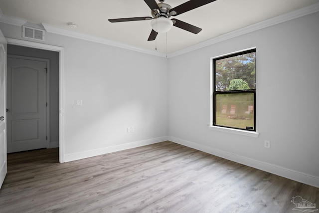 empty room with ceiling fan, light hardwood / wood-style floors, and crown molding