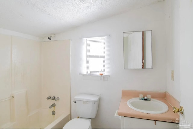 full bathroom featuring shower / bath combination, vanity, toilet, and a textured ceiling