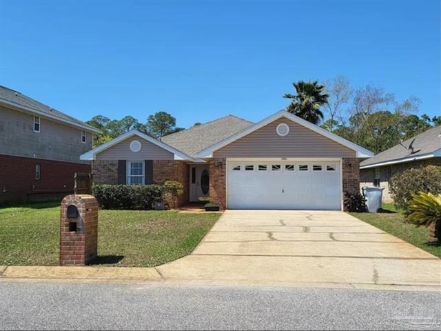 ranch-style home featuring an attached garage, driveway, a front yard, and brick siding