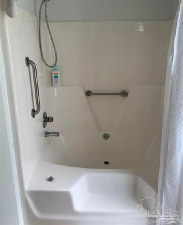 full bath with a tub and curtained shower