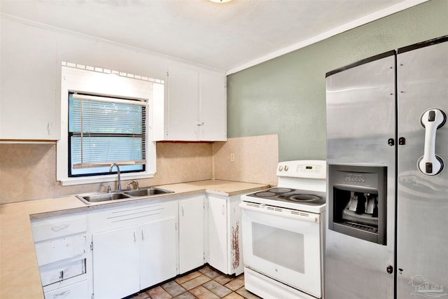 kitchen featuring white range with electric stovetop, white cabinets, and sink