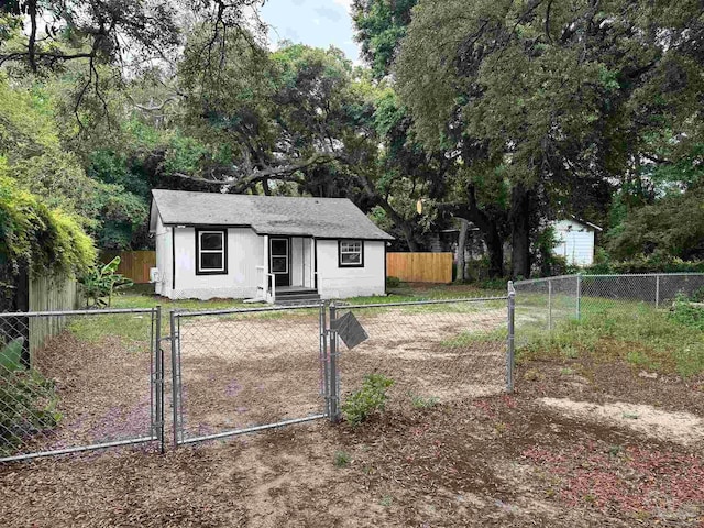 view of front of home featuring a fenced front yard and a gate