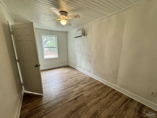 empty room featuring a wall unit AC, wooden ceiling, baseboards, and wood finished floors