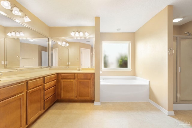 bathroom with vanity, plus walk in shower, and a textured ceiling