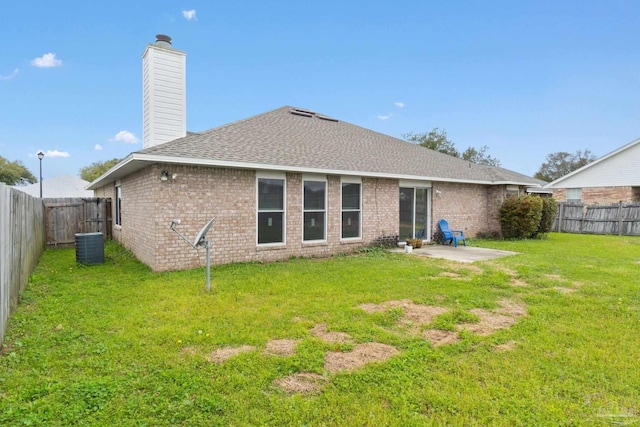 back of property featuring central AC, a patio, and a lawn