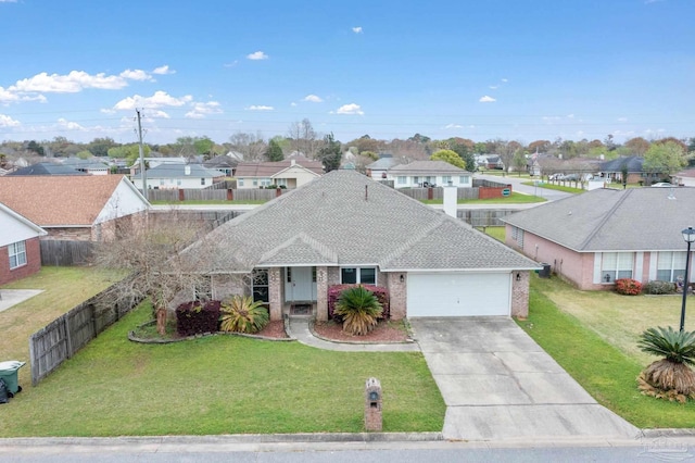 view of front of property with a garage and a front lawn