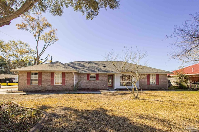 ranch-style home with a front lawn